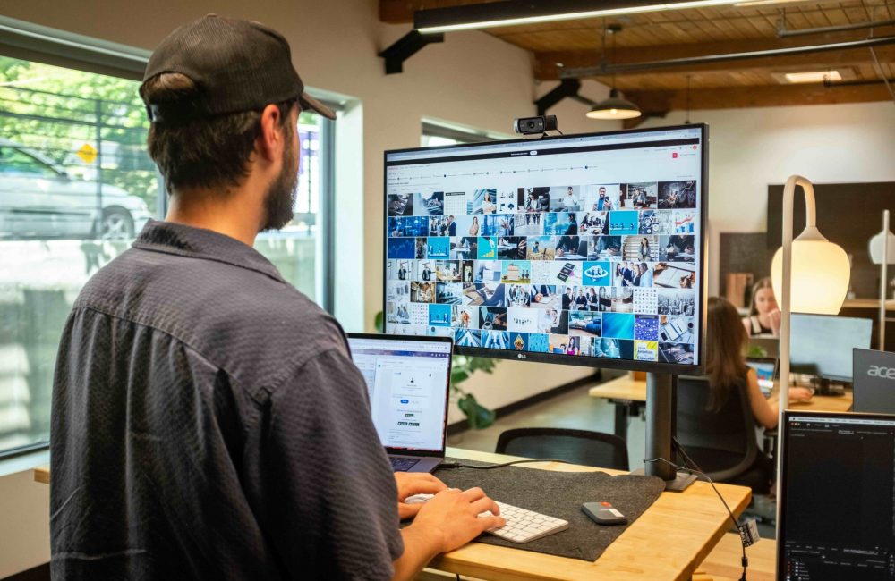 marketing professional searching for stock images on a computer